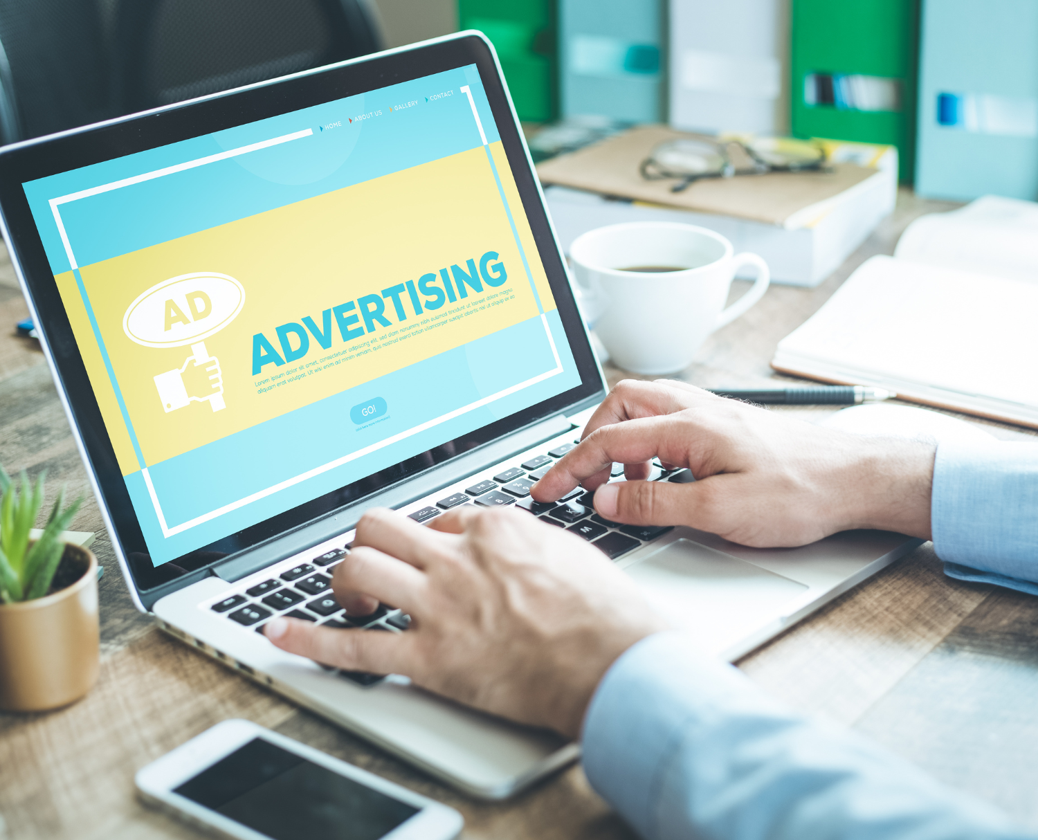 Person building print and digital bank advertisements from template library